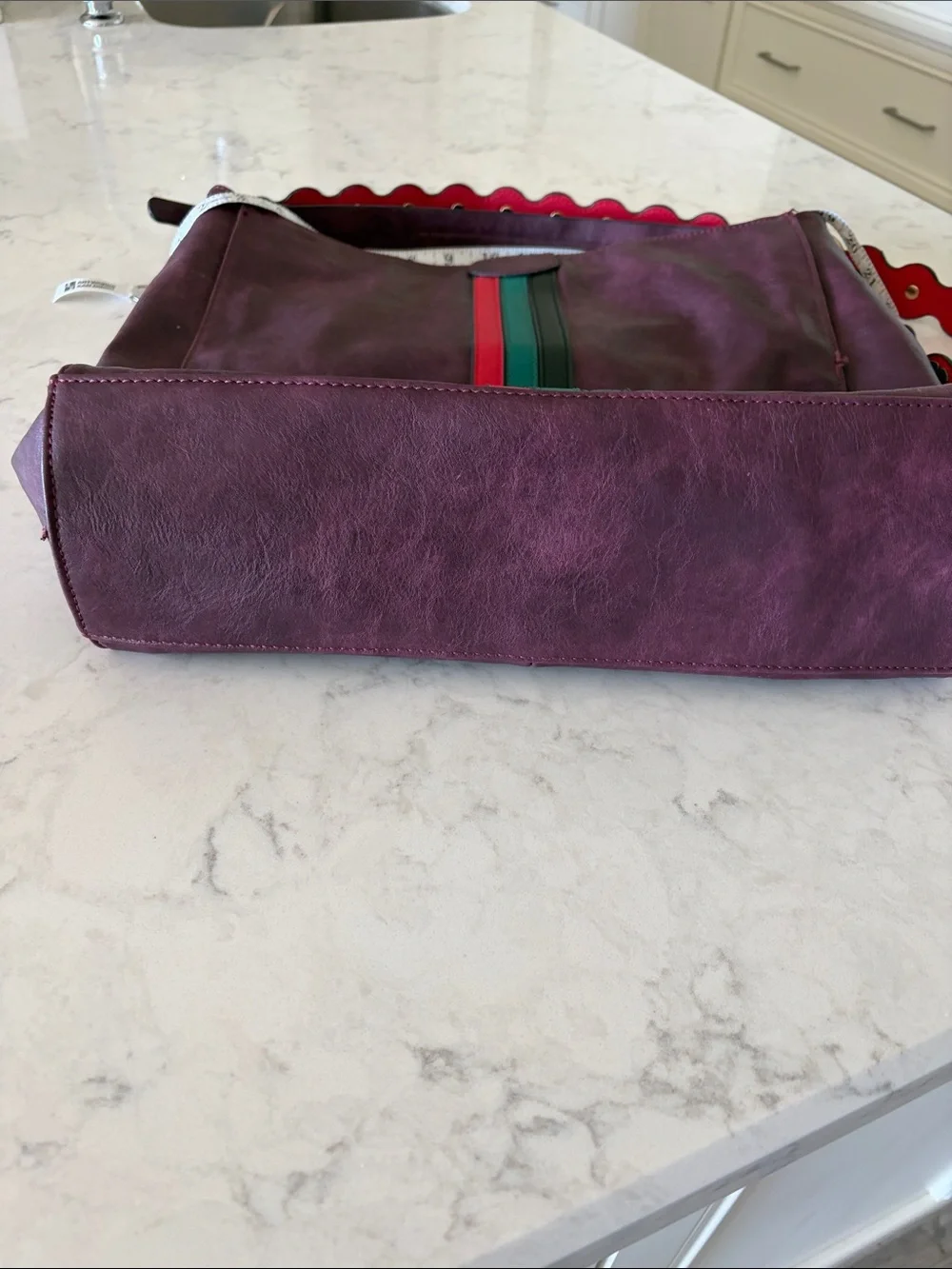 Large Burgundy leather bag with red and green accents